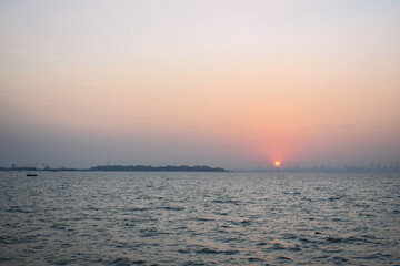 Sunset beside the ocean near Mumbai shore