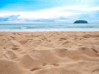 close up sand beach groud floor, island on sea with cloudy blue sky background at day time