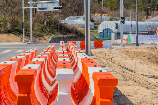 White and orange plastic traffic barriers
