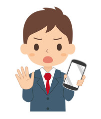 NOサインでスマートフォンを持つ男子学生