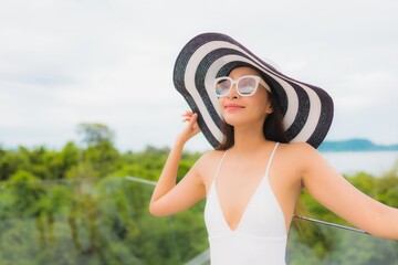 Portriat beautiful young asian woman happy smile around balcony with sea view