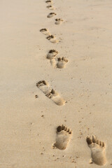 Human footprints on the beach sand.