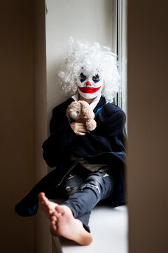 Scary evil clown boy