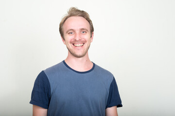 Fototapeta premium Face of happy handsome man with blond hair smiling