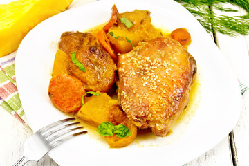 Chicken roast with pumpkin and dried apricots on white board