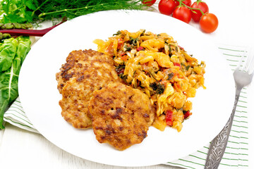 Fritters meat with cabbage in plate on white board