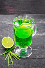 Lemonade Tarragon in goblet on black board