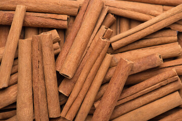 Close up macro photo of tasty cinnamon sticks background