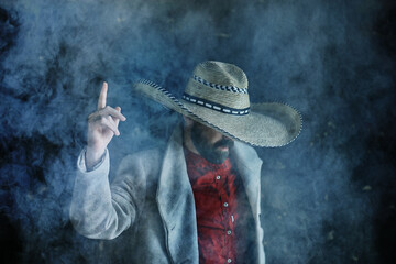 farmer hipster in a straw hat with brim in smoke smoking tobacco retro style wild west sambrero