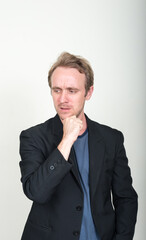 Portrait of stressed businessman with blond hair thinking