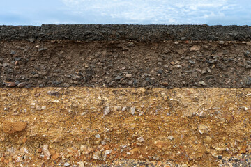 The layer of asphalt road with soil and rock.