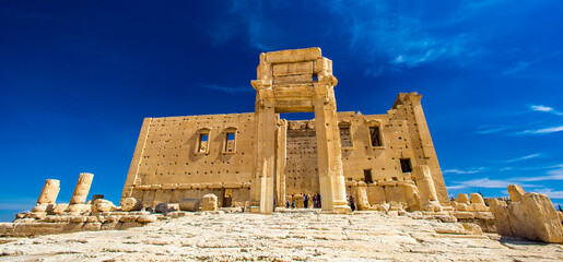 It's Temple of Bel , an ancient stone ruin located in Palmyra, Syria.