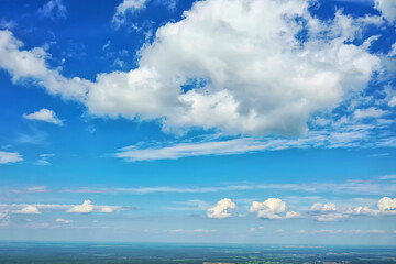 Fototapeta na wymiar white clouds on blue sky background, abstract seasonal wallpaper, sunny day atmosphere