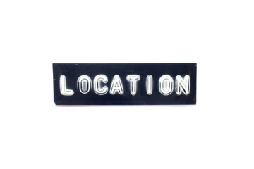 Embossed letter in word location on black banner with white background