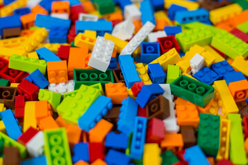Close-up of a cluttered pile of colorful toy bricks