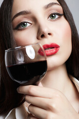 beautiful Girl with glass of wine. Beautiful woman drinking red wine