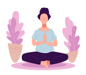 Woman practicing yoga asanas or meditation at home