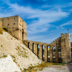 It's Citadel of Aleppo, a large medieval fortified palace of the old city of Aleppo, northern Syria.