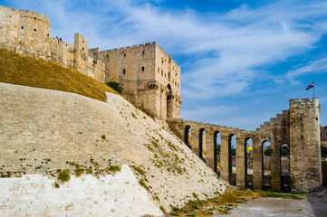 Fototapeta na wymiar It's Citadel of Aleppo, a large medieval fortified palace, the old city of Aleppo, northern Syria.