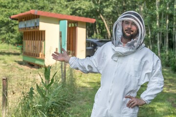 Beekeeper with his bee hive