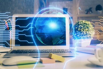 Double exposure of work space with computer and human brain drawing hologram. Brainstorm concept.