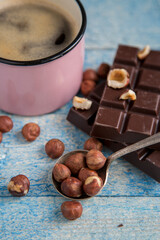 Kraft chocolate with different tastes and aromatic coffee on the table