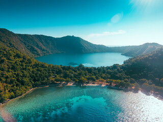 Aerial view of Satonda Island, Indonesia. The idyllic volcanic island of Satonda is fringed by...
