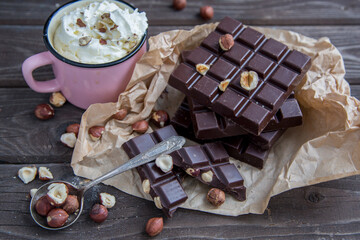 Kraft chocolate with different tastes and aromatic coffee on the table