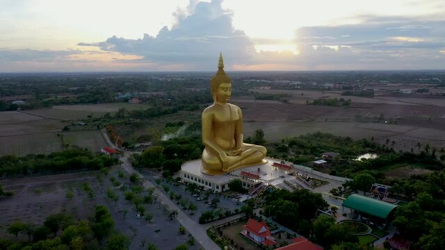 Aerial footage from a drone of the Big Buddha statue at Wat Muang, Ang Thong Province, Thailand