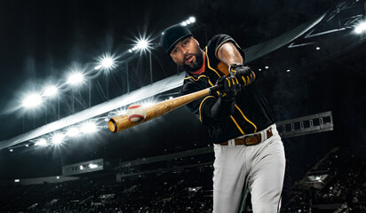 Porfessional baseball player with bat taking a swing on grand arena. Ballplayer on stadium in...