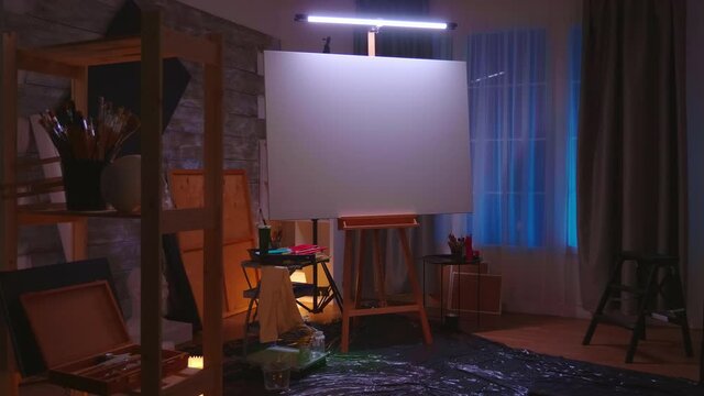Wooden easel with blank canvas in empty art studio Modern artwork paint on canvas, creative, contemporary and successful fine art artist drawing masterpiece