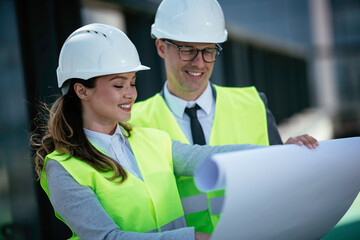 Man and woman discussing work. Colleagues working on project.	
