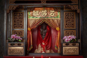 The statue of the god Vishnu is one of the deities worshiped at the Tjoe Tik Bio temple, Juwana, Pati, Central Java.