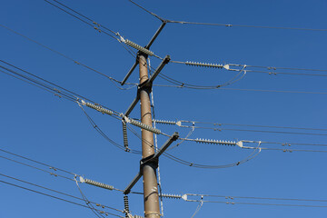 Kuching, Sarawak / Malaysia - August 28, 201t: Power poles and cables in blue sky.