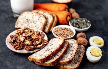 Products containing vitamins B1 (thiamine) on a stone background
