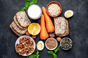 Products containing vitamins B1 (thiamine) on a stone background