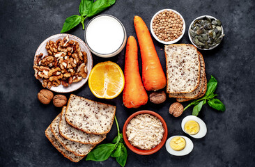 Products containing vitamins B1 (thiamine) on a stone background