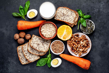 Products containing vitamins B1 (thiamine) on a stone background