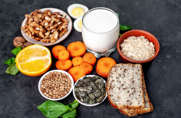 Products containing vitamins B1 (thiamine) on a stone background