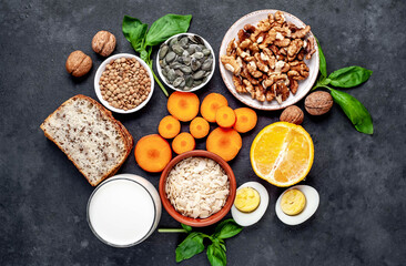 Products containing vitamins B1 (thiamine) on a stone background