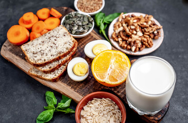 Products containing vitamins B1 (thiamine) on a stone background