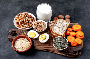 Products containing vitamins B1 (thiamine) on a stone background