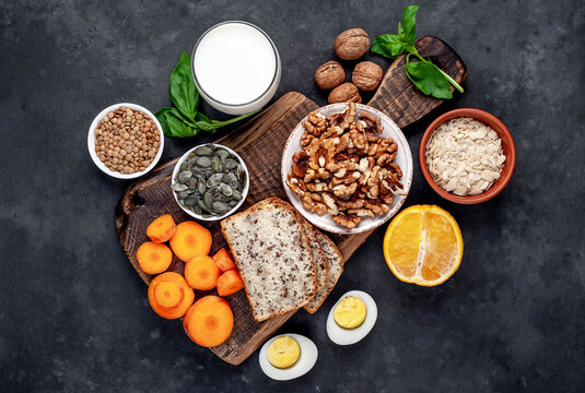 Products containing vitamins B1 (thiamine) on a stone background