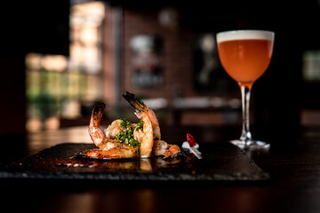 Amazing Prawns dish with orange cocktail