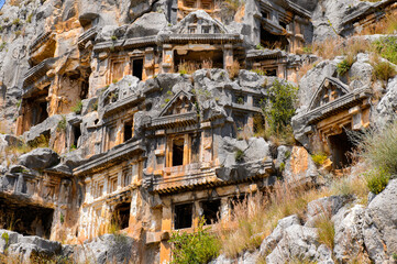 Obraz premium It's Ancient rock cut tombs of the Lycian necropolis, Myra, Turkey