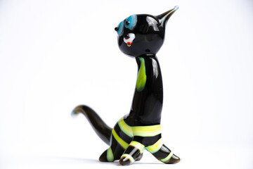 figurine black cat made of glass on a white background handmade as a souvenir