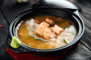 Ishikari miso soup with salmon in a black bowl