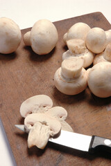 Mushrooms on Wooden Shingle on white background .