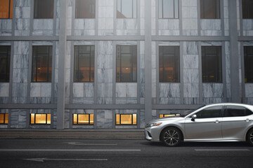 business district street with parked premium car