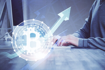 Blockchain theme hud with businessman working on computer on background. Concept of crypto chain....